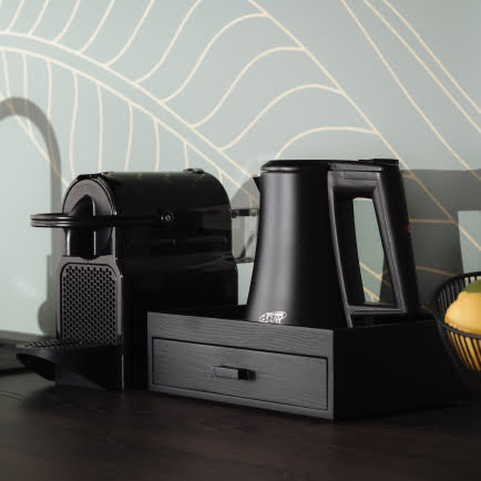 A modern coffee machine and kettle.